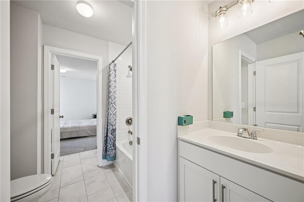 1283 Maston Road Auburn, GA 30011 - Photo 44 of 82 a bathroom with a sink double vanity and a shower