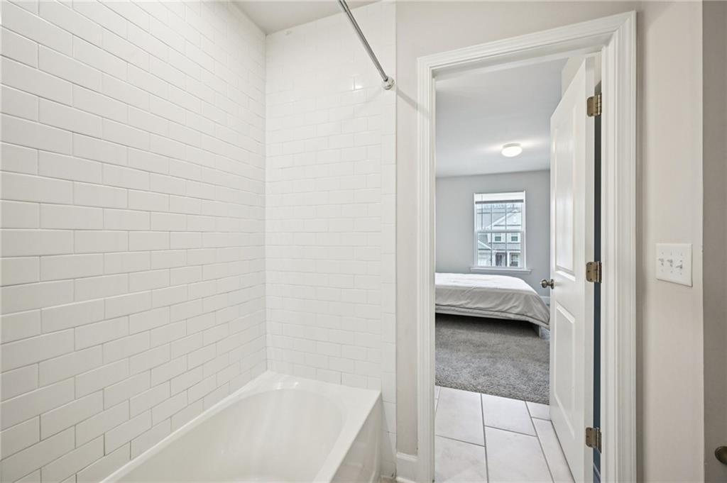 1283 Maston Road Auburn, GA 30011 - Photo 46 of 82 a en suite bathroom with a sink and a mirror