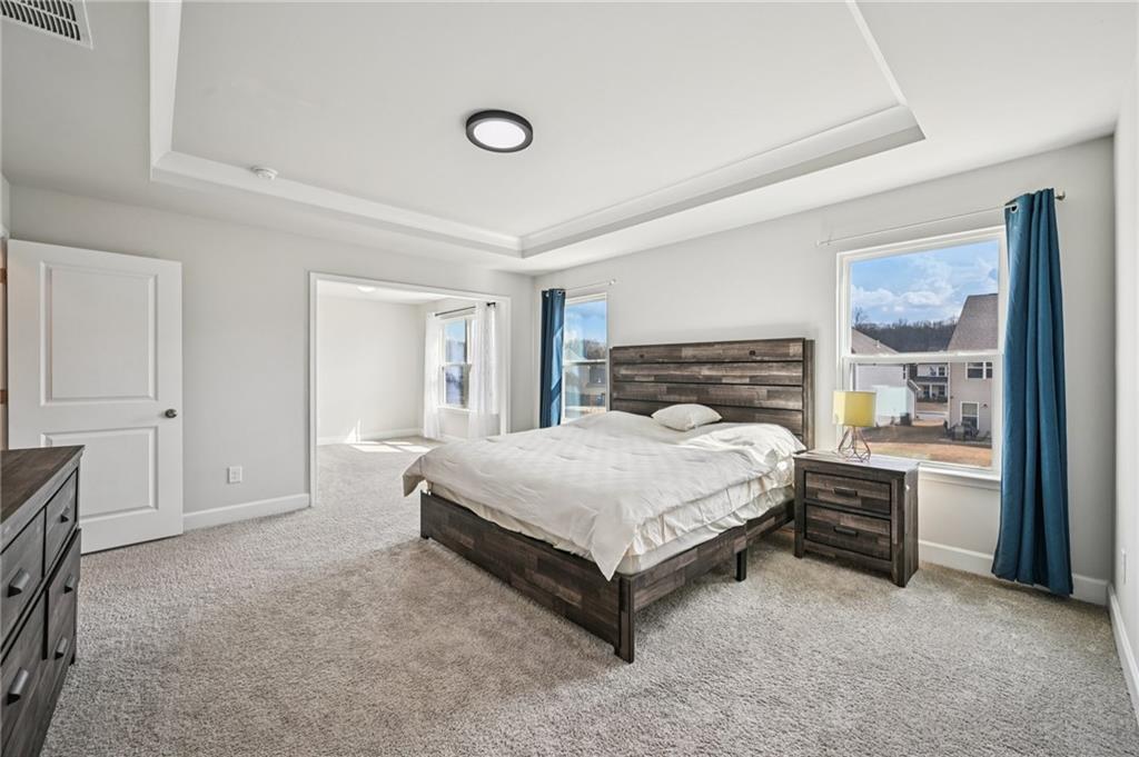 1283 Maston Road Auburn, GA 30011 - Photo 53 of 82 a bed sitting in a spacious bedroom next to a window