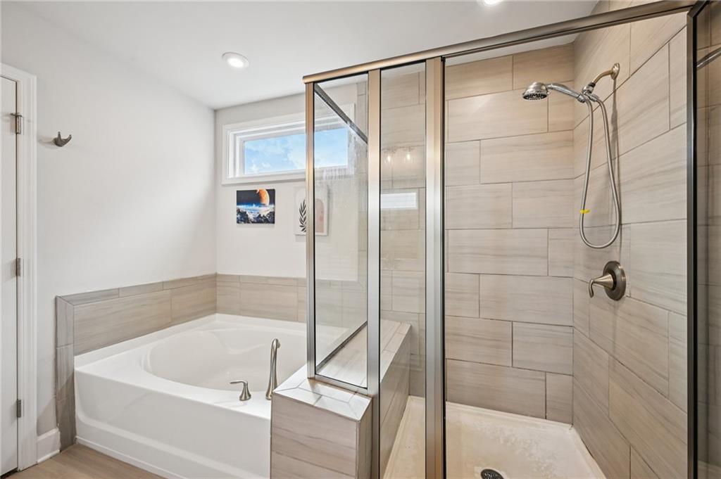 1283 Maston Road Auburn, GA 30011 - Photo 55 of 82 a bath tub sitting next to a shower