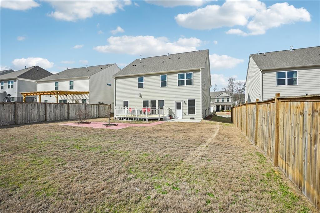1283 Maston Road Auburn, GA 30011 - Photo 62 of 82 a view of a house with backyard and sitting area