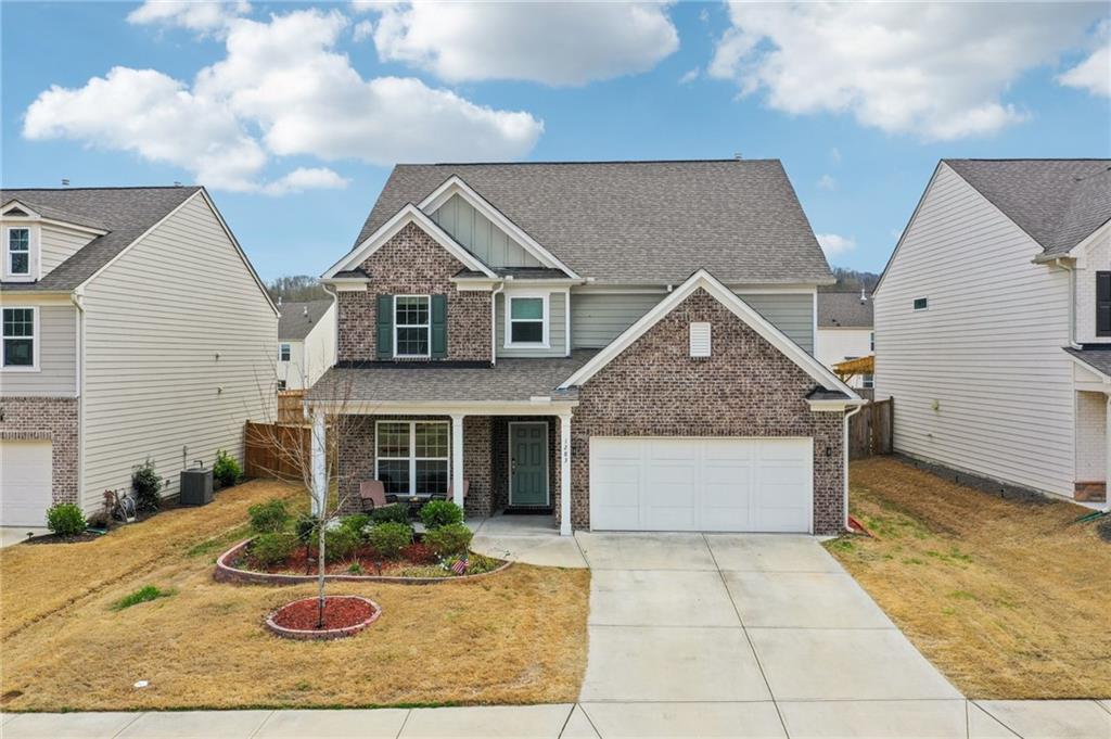 1283 Maston Road Auburn, GA 30011 - Photo 66 of 82 a front view of house with yard outdoor seating and barbeque oven