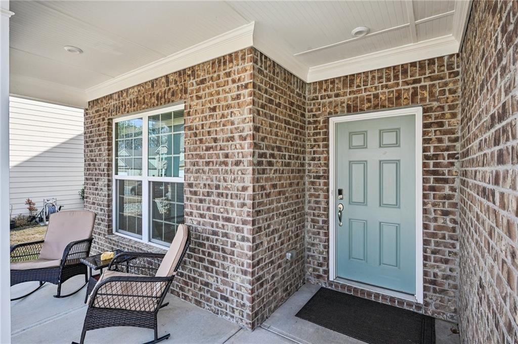 1283 Maston Road Auburn, GA 30011 - Photo 7 of 82 a view of a door with a chair and a window