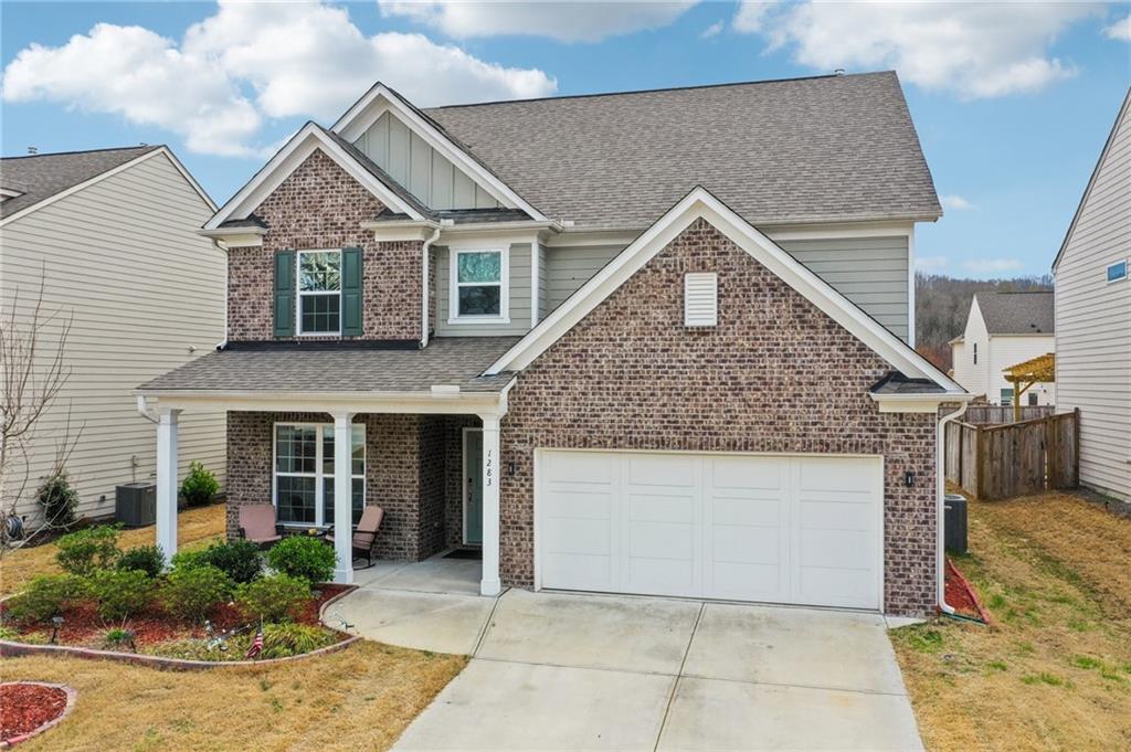 1283 Maston Road Auburn, GA 30011 - Photo 71 of 82 a front view of a house with garden