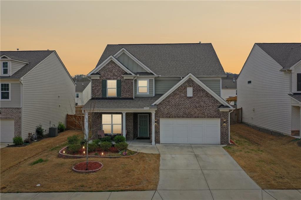 1283 Maston Road Auburn, GA 30011 - Photo 75 of 82 a front view of house with garage and yard