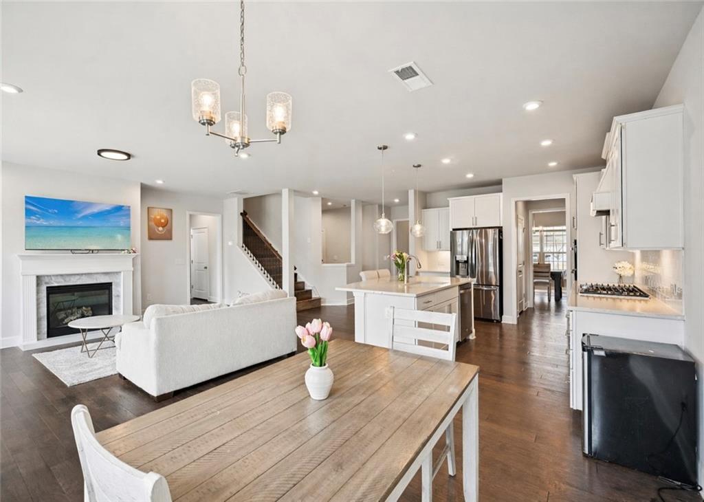 1283 Maston Road Auburn, GA 30011 - Photo 76 of 82 a living room with furniture and a fireplace