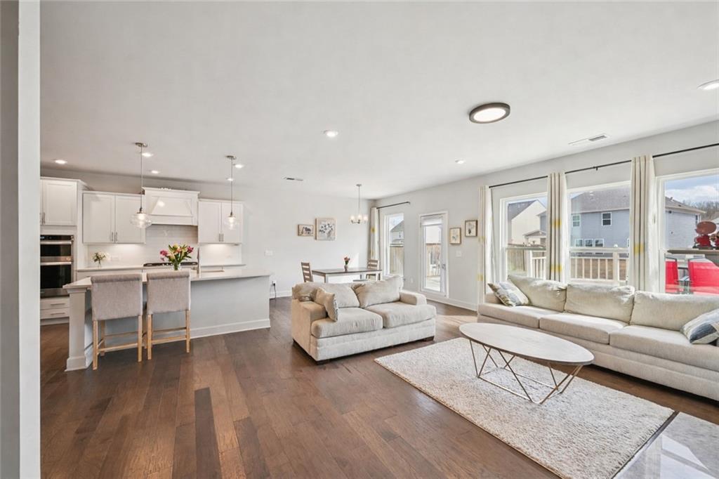 1283 Maston Road Auburn, GA 30011 - Photo 9 of 82 a living room with furniture and a large window