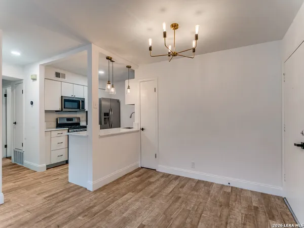 a view of kitchen with wooden floor and window
