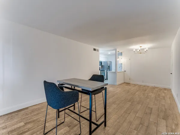 a kitchen with a table and chairs