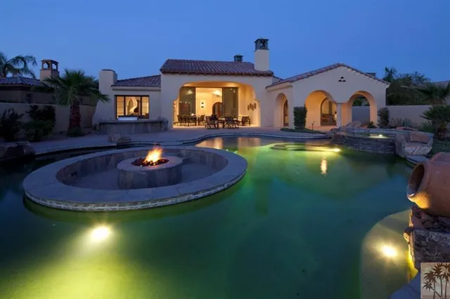 a view of a swimming pool with lounge chair