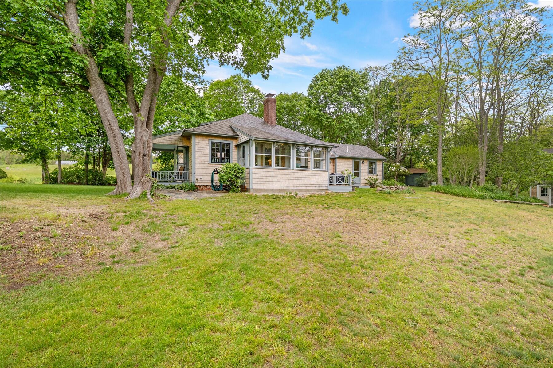 21 Quaker Road East Sandwich, MA 02537 - Photo 8 of 43 a house view with a garden space