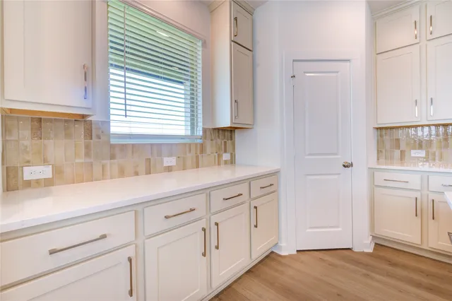 a bathroom with a sink and a window