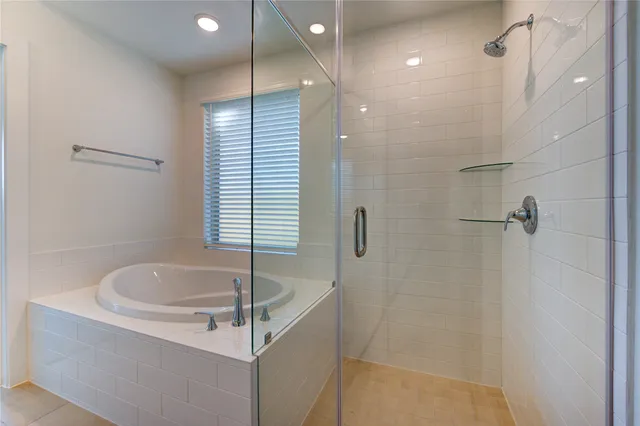 a bathroom with a sink a bathtub and shower