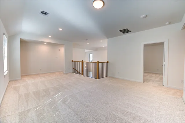 a view of a kitchen with a sink and white cabinets