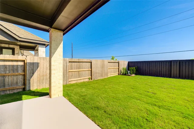 a view of a backyard with a cabin