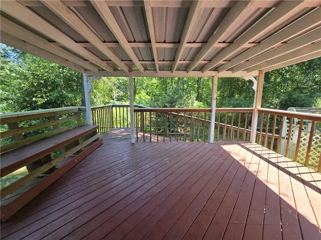 a view of balcony with wooden floor