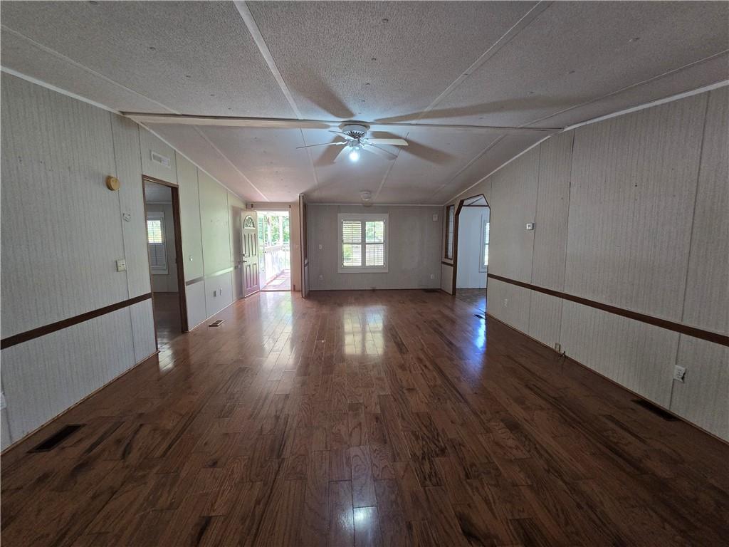 1120 Fincherville Road Jackson, GA 30233 - Photo 18 of 38 a view of empty room with wooden floor and fan