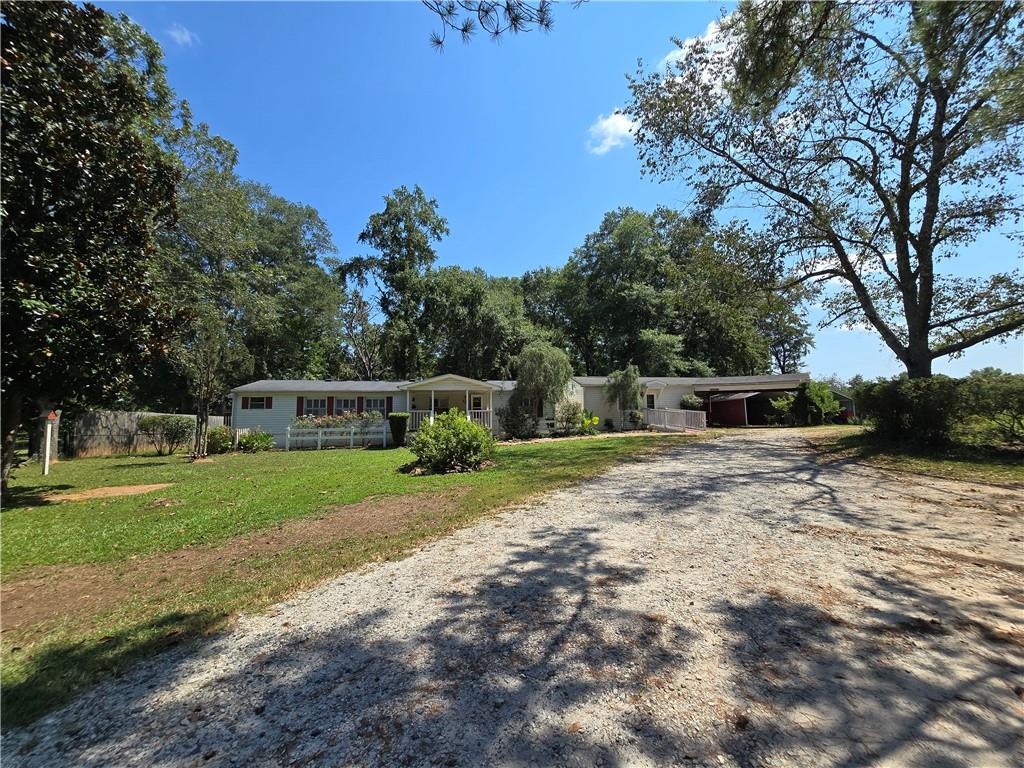 1120 Fincherville Road Jackson, GA 30233 - Photo 36 of 38 a front view of a house with a yard
