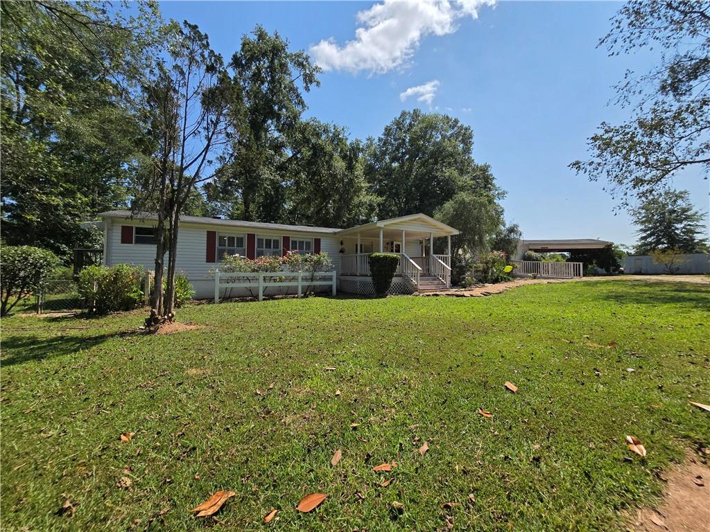 1120 Fincherville Road Jackson, GA 30233 - Photo 37 of 38 a view of house with backyard and outdoor seating