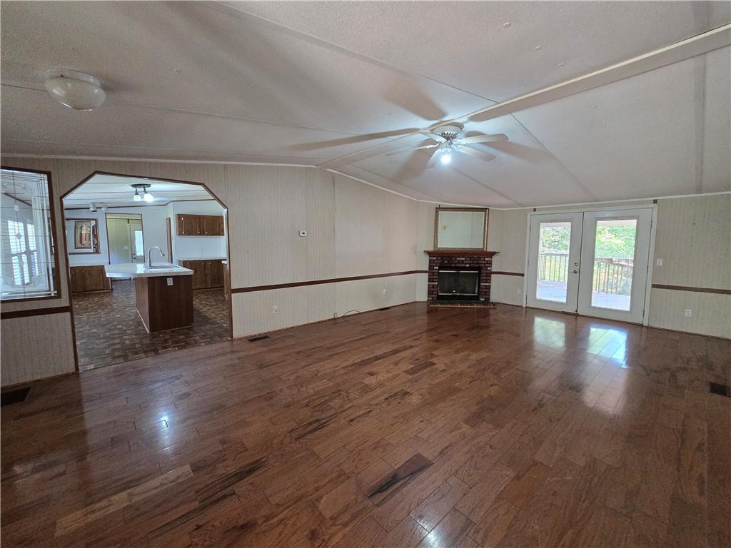 1120 Fincherville Road Jackson, GA 30233 - Photo 7 of 38 a view of a livingroom with furniture a ceiling fan and wooden floor