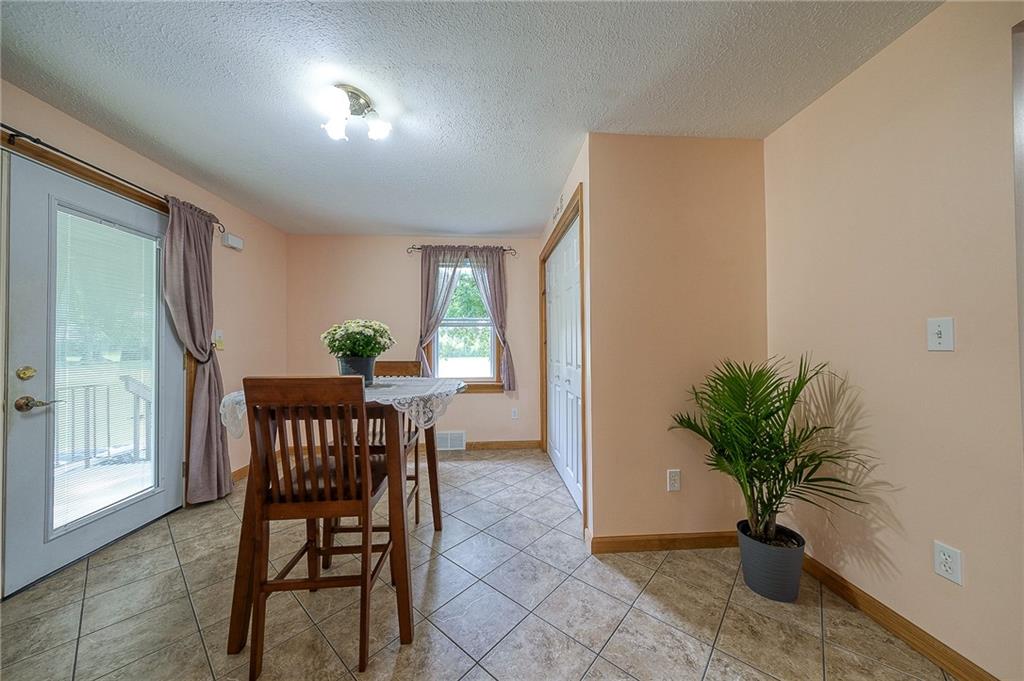 393 Freeport Road Butler, PA 16002 - Photo 7 of 43 a view of a workspace with furniture and a potted plant