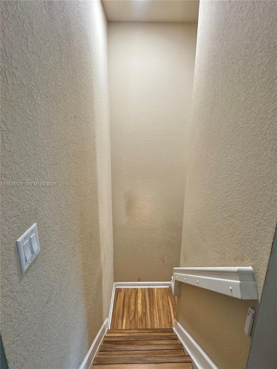 23477 Southwest 112th Place Homestead, FL 33032 - Photo 13 of 49 a view of a room with wooden floor