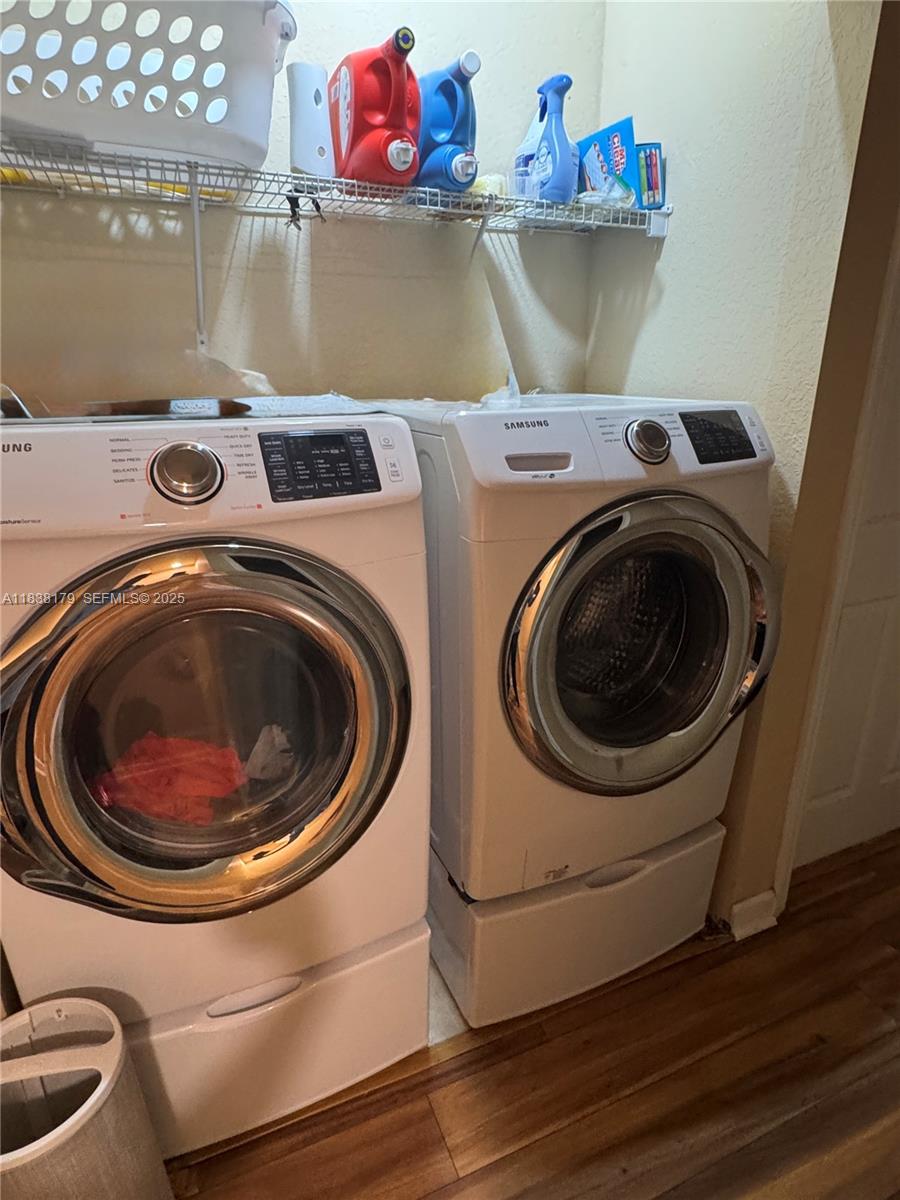 23477 Southwest 112th Place Homestead, FL 33032 - Photo 15 of 49 a utility room with dryer and washer