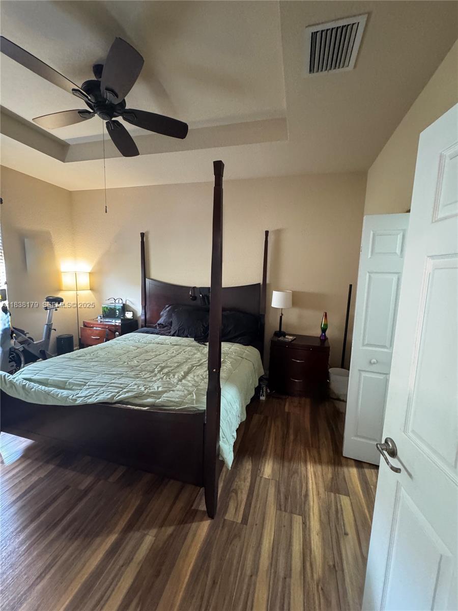 23477 Southwest 112th Place Homestead, FL 33032 - Photo 16 of 49 a bed room with a bed