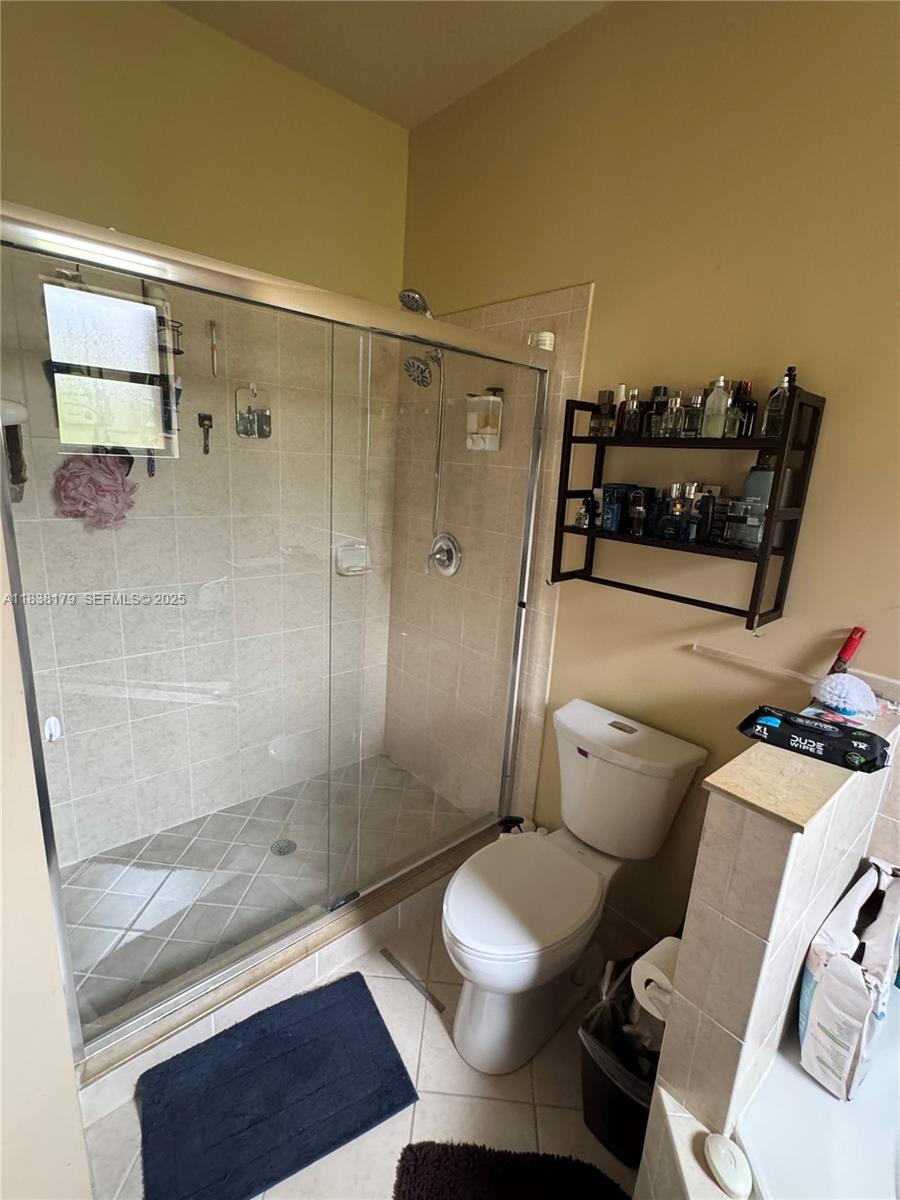 23477 Southwest 112th Place Homestead, FL 33032 - Photo 20 of 49 a bathroom with a toilet and a shower