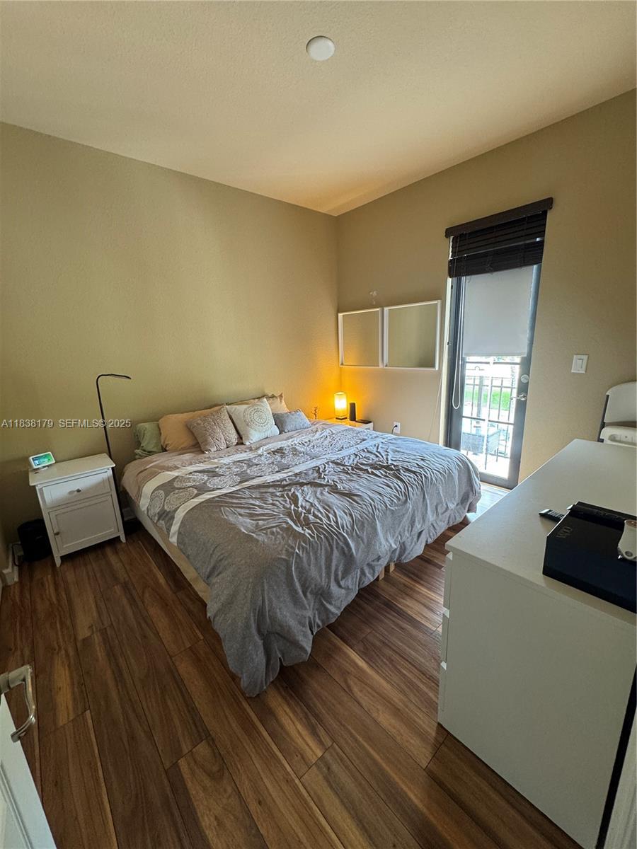 23477 Southwest 112th Place Homestead, FL 33032 - Photo 21 of 49 a bedroom with bed and window