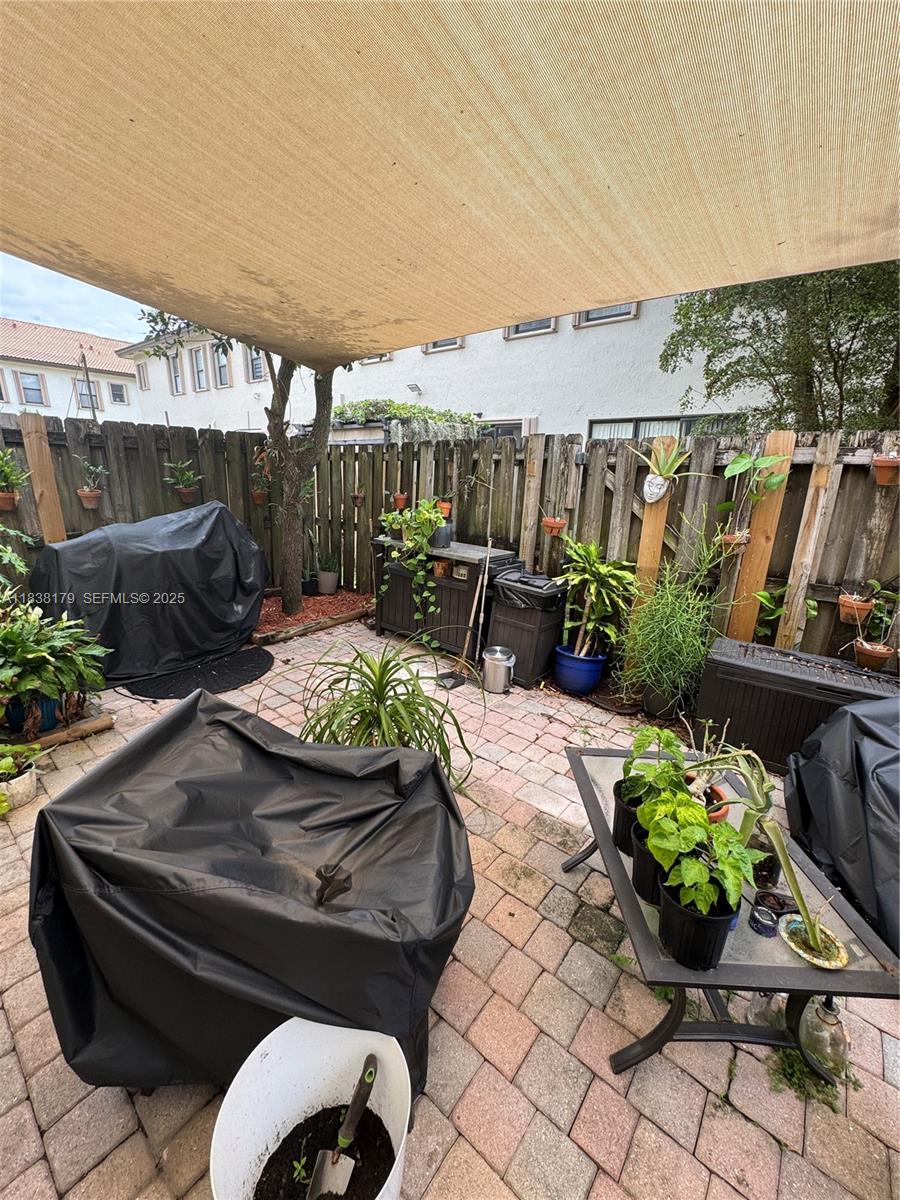 23477 Southwest 112th Place Homestead, FL 33032 - Photo 27 of 49 a outdoor space with lots of furniture and green space