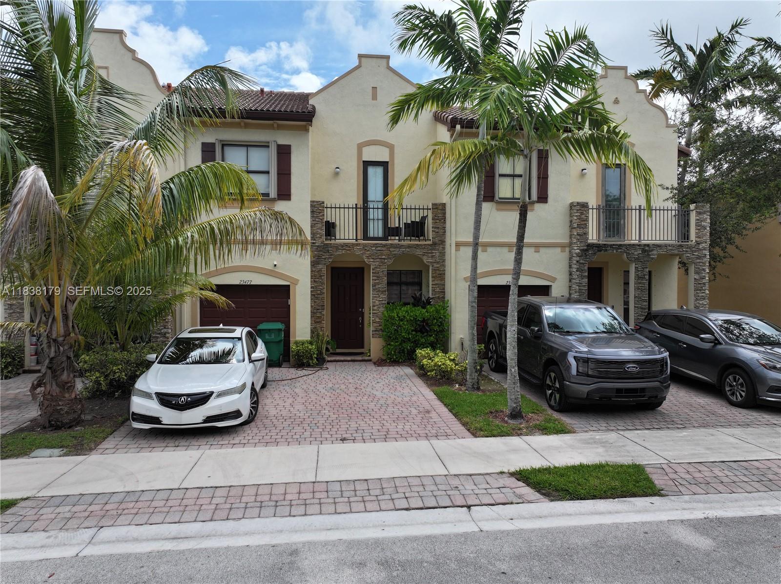 23477 Southwest 112th Place Homestead, FL 33032 - Photo 29 of 49 a car parked in front of a house