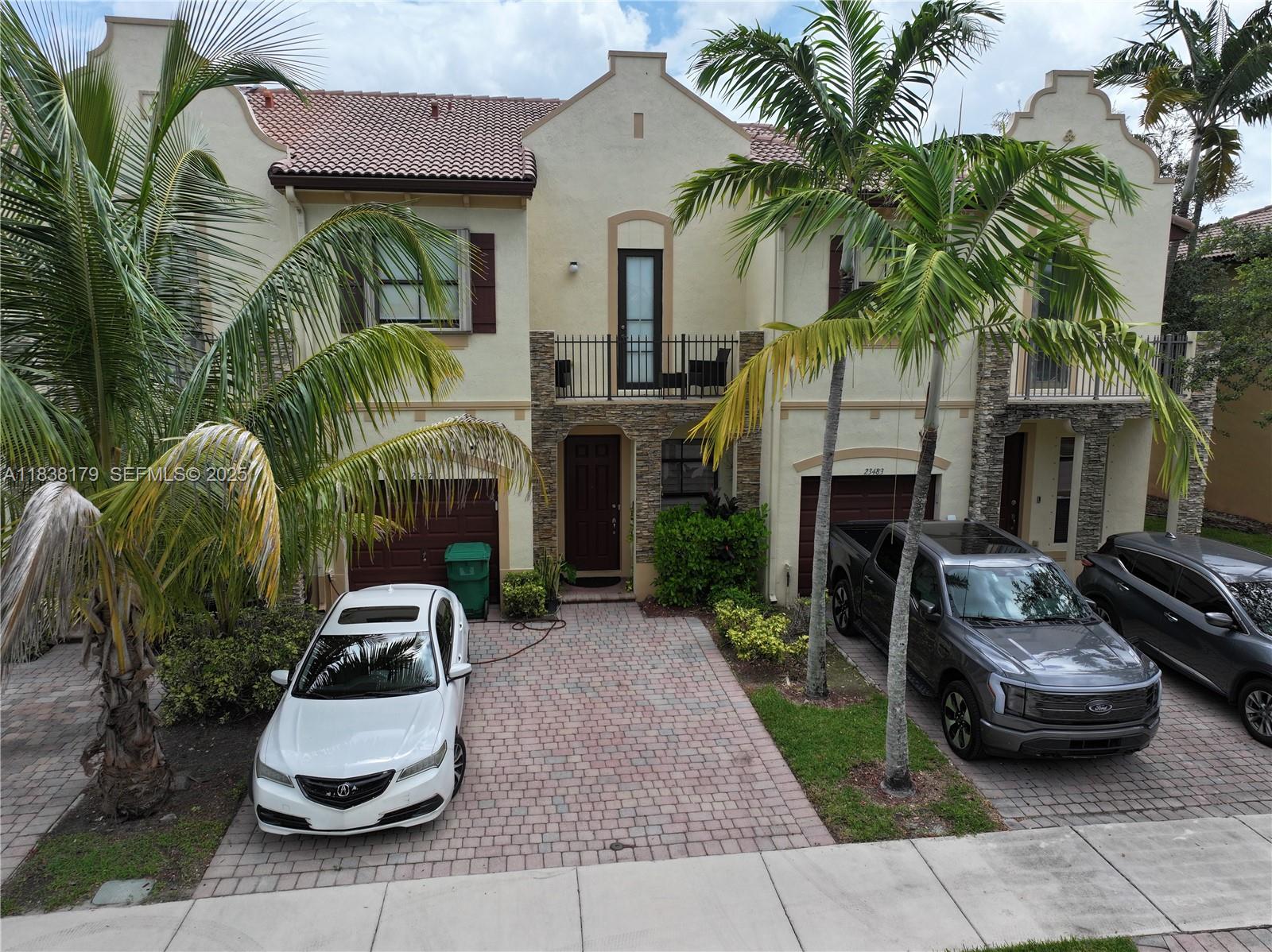 23477 Southwest 112th Place Homestead, FL 33032 - Photo 30 of 49 a front view of a house with patio
