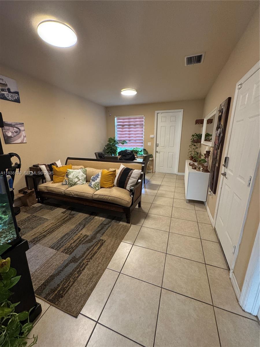 23477 Southwest 112th Place Homestead, FL 33032 - Photo 3 of 49 a living room with furniture