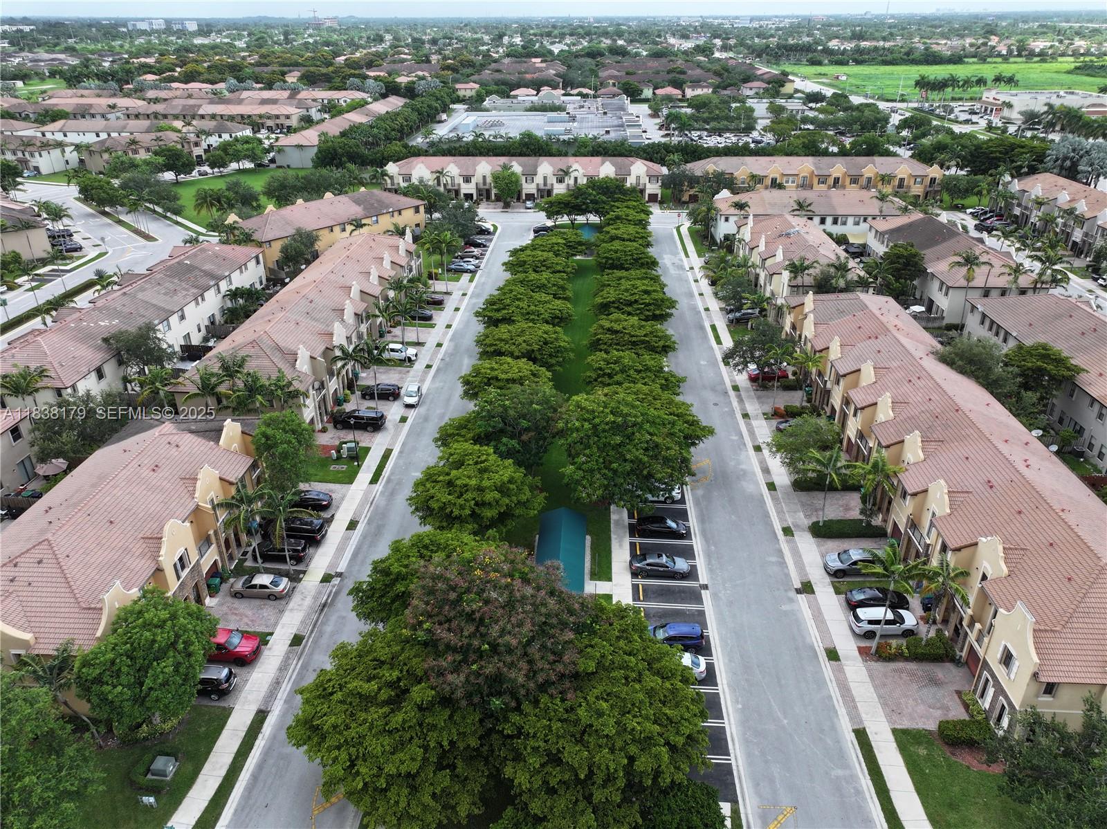 23477 Southwest 112th Place Homestead, FL 33032 - Photo 37 of 49 an aerial view of a city with lots of residential buildings