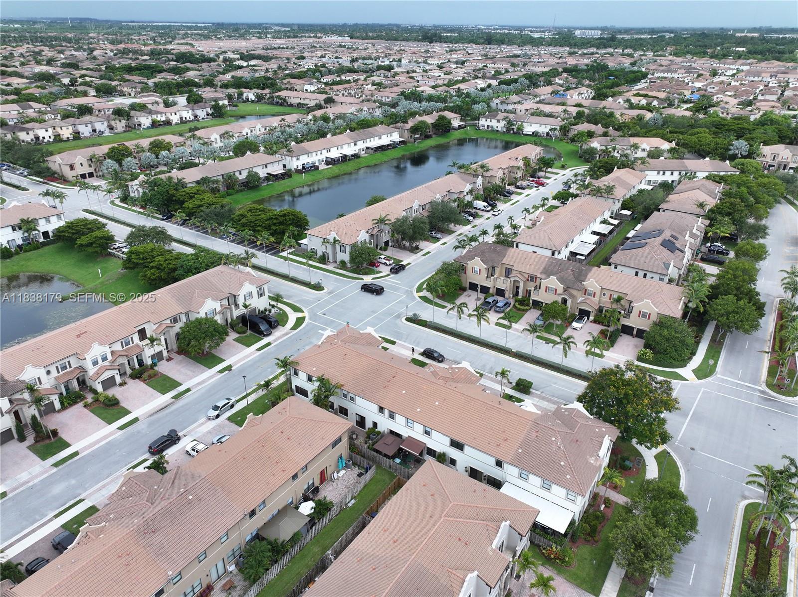 23477 Southwest 112th Place Homestead, FL 33032 - Photo 48 of 49 an aerial view of a city with lots of residential buildings