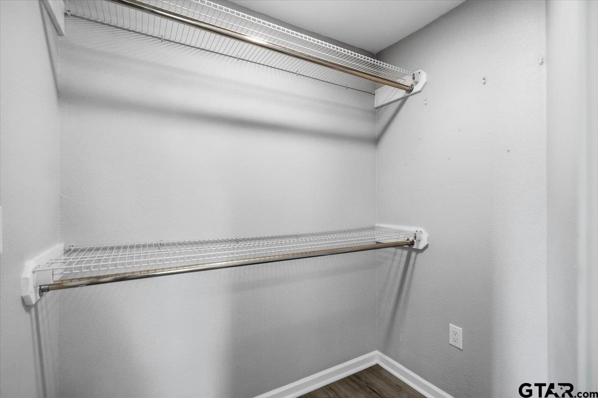 701 Georgia Street Lindale, TX 75771 - Photo 18 of 37 a view of a room with racks on the wall
