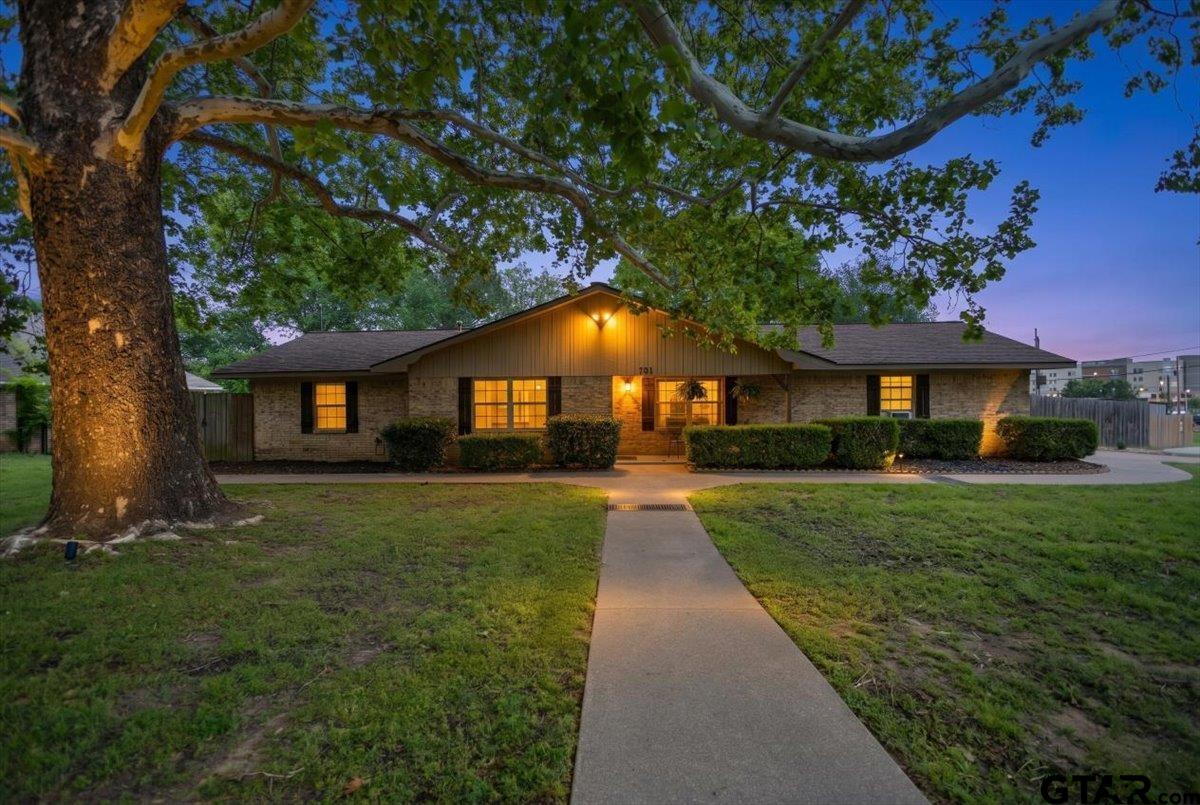 701 Georgia Street Lindale, TX 75771 - Photo 2 of 37 a front view of a house with a yard