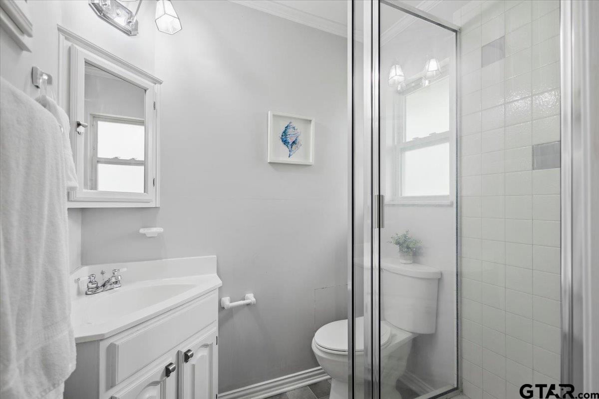 701 Georgia Street Lindale, TX 75771 - Photo 21 of 37 a bathroom with a sink toilet and shower