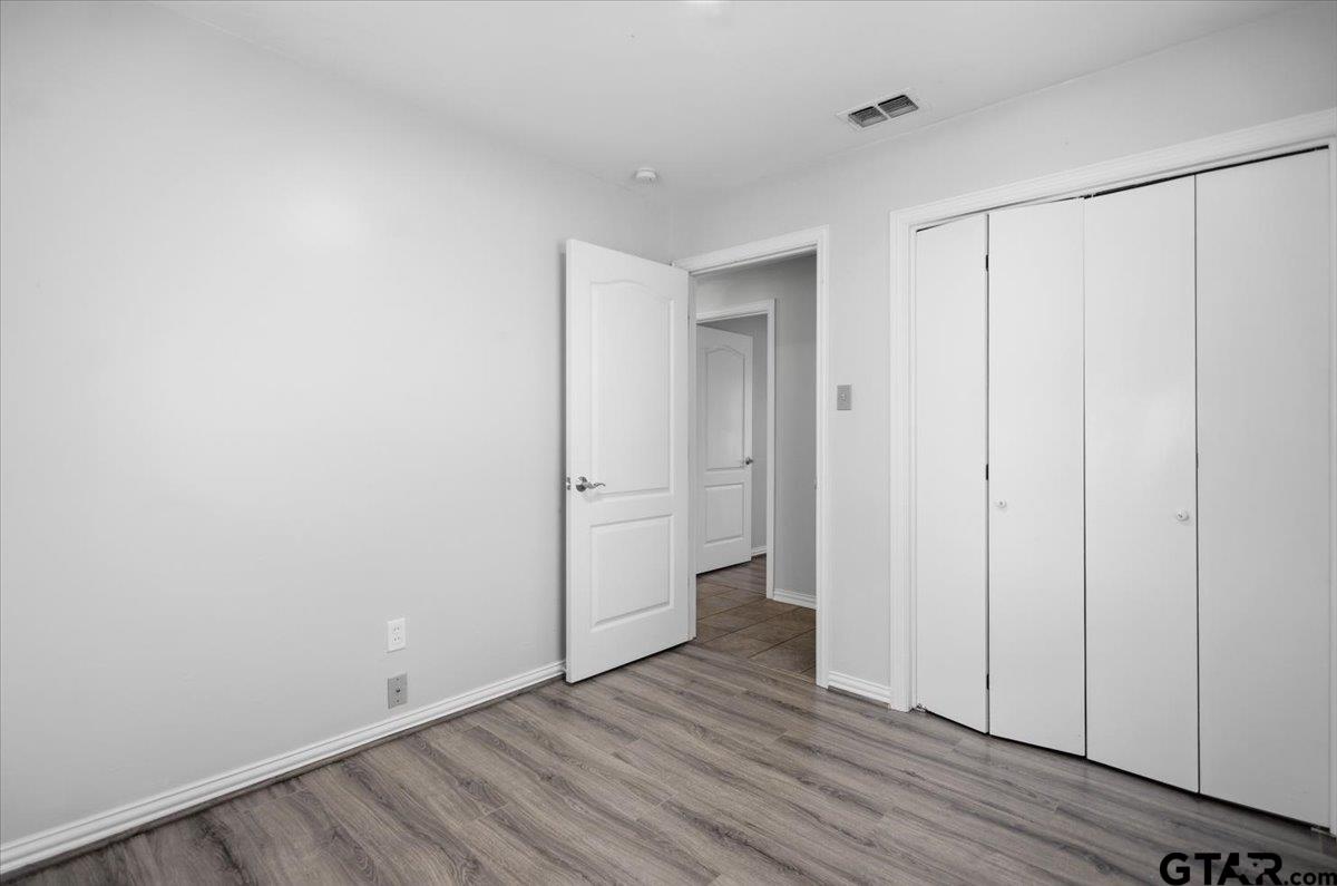 701 Georgia Street Lindale, TX 75771 - Photo 26 of 37 a view of an empty room and wooden floor