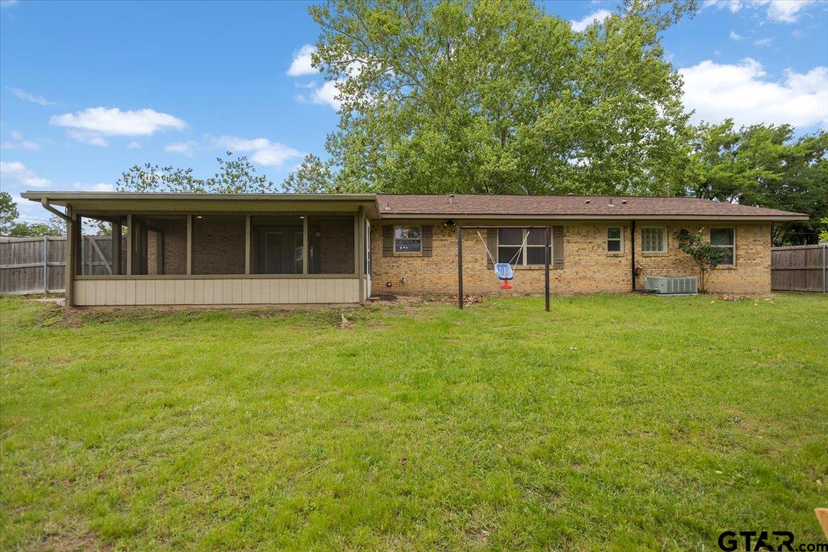 701 Georgia Street Lindale, TX 75771 - Photo 29 of 37 a view of a house with a backyard