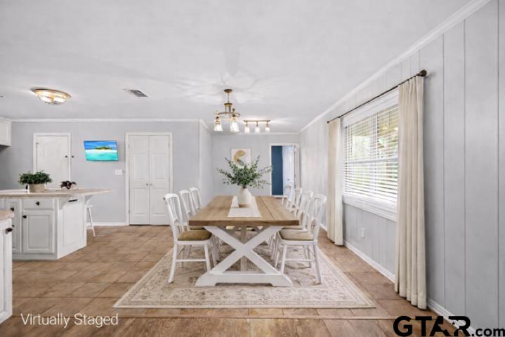 701 Georgia Street Lindale, TX 75771 - Photo 9 of 37 a view of a dining room with furniture and chandelier