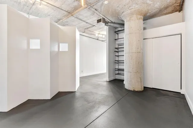 a view of a room with a hallway