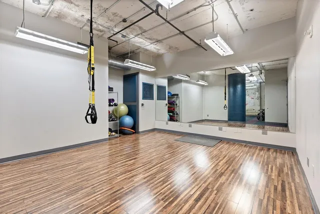 a view of a room with wooden floor