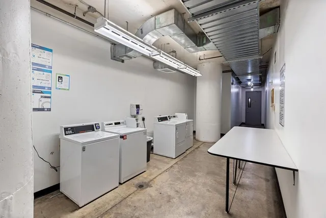 a view of storage and utility room with racks on the wall