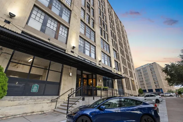 a front view of a building with a street