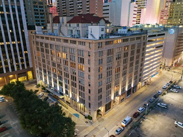 a view of a building with a street