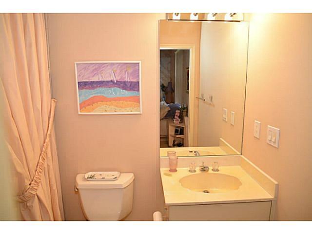17064 Ryton Lane Boca Raton, FL 33496 - Photo 18 of 23 a bathroom with a sink a mirror and a shower curtain