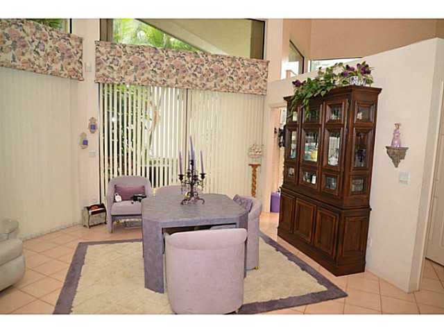 17064 Ryton Lane Boca Raton, FL 33496 - Photo 20 of 23 a dining room with furniture and wooden floor