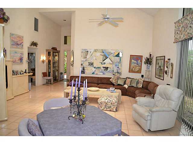 17064 Ryton Lane Boca Raton, FL 33496 - Photo 22 of 23 a living room with furniture and a kitchen view